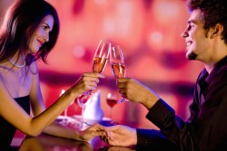 Amorous couple on romantic date or celebrating together at resta